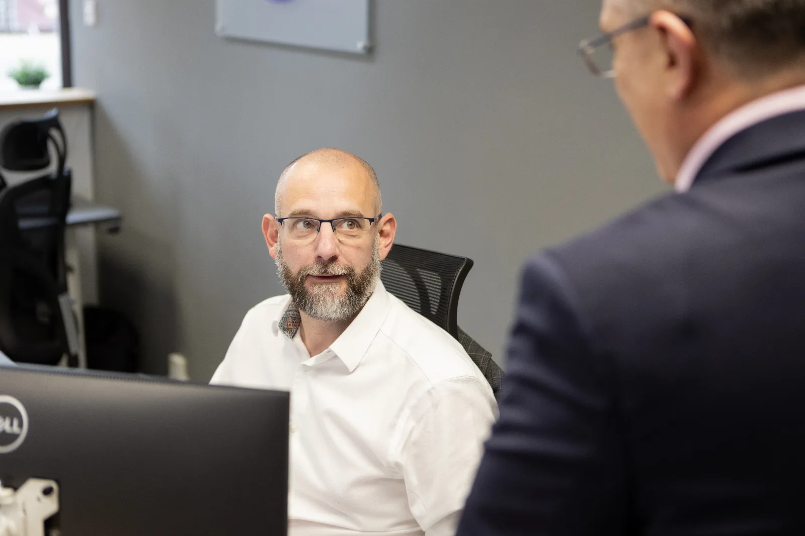 A Spolton adviser listening to a client